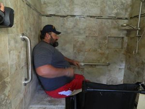 With a $40,000 donation from the Tampa Bay Buccaneers, Rebuilding Together Tampa Bay remodeled Bernts' home to meet ADA standards, as evident in his new shower, which was designed with zero barriers and a bench.