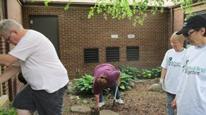 NARI Director of Education, Dan Taddei digs a hole as Executive Vice President, Mary Harris and Adminstrative Assistant, Judy Carlsen look on.