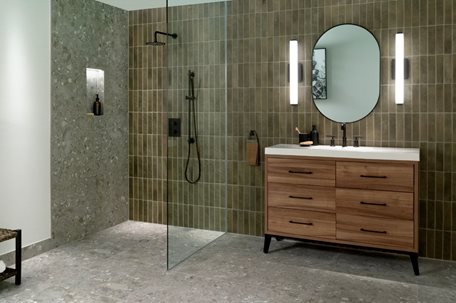 A bathroom with a shower and a sinkDescription automatically generated
